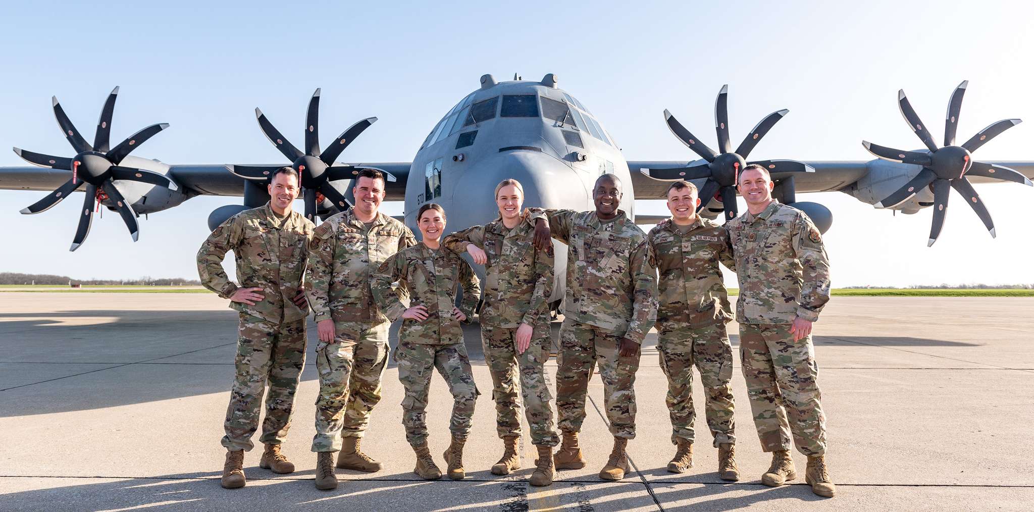 7 Air National Guard members standing in front of a C130 Hercules
